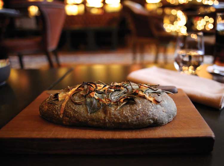 The NoMad A thing of beauty! The baked to order bread topped with sweet potato, zucchini, sage and rosemary, comes to the table piping hot with a carving knife and is utterly delicious!