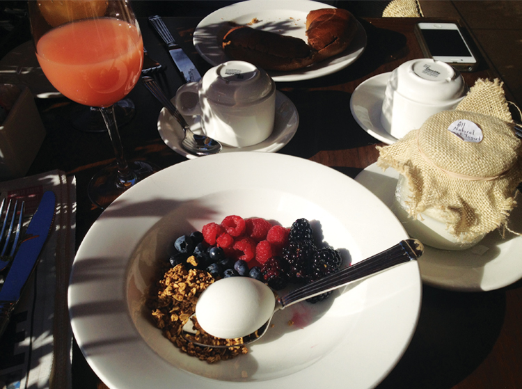 Sunset Tower Enjoying a simple, healthy breakfast spread on the terrace while peeking over our shades in an attempt to celebrity spot. 