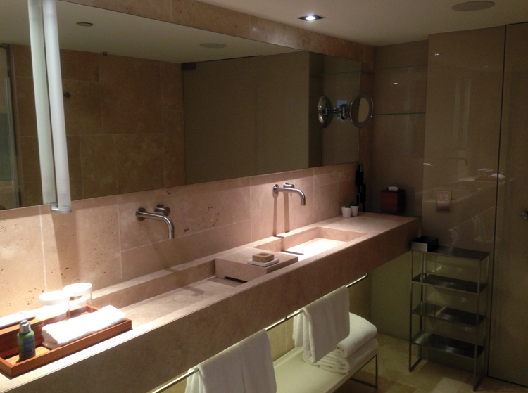 Conservatorium Hotel Double sinks for him & her. Nice light and towel warmers. 