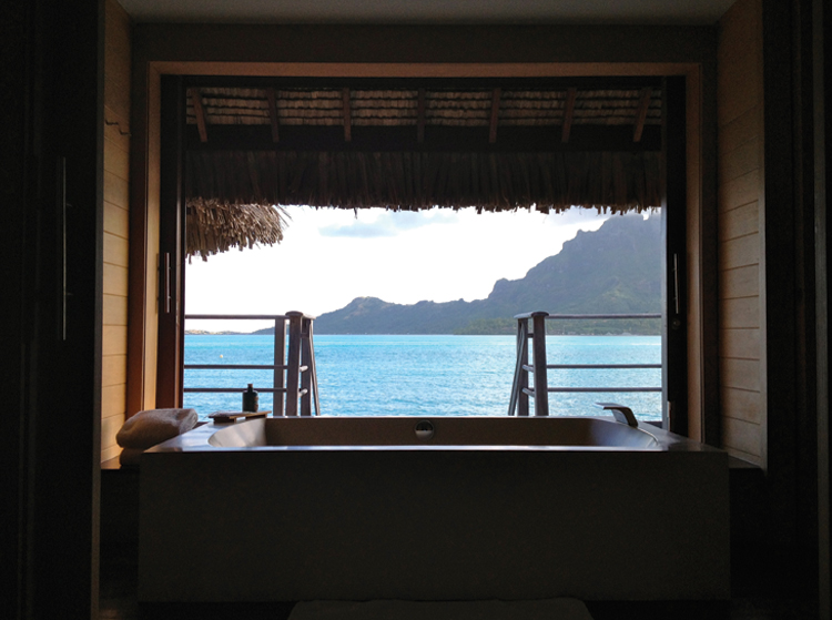 Four Seasons Bora Bora Your private jacuzzi with doors that open to the sea.