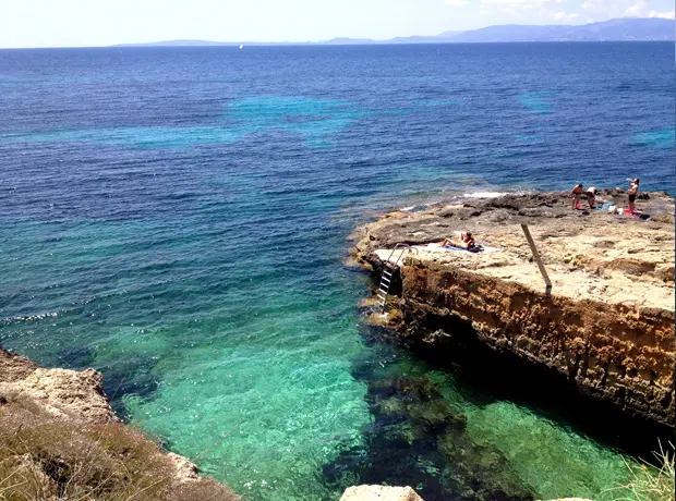 Cap Rocat The ‘rock beach’ at the base of the hotel - guests layout on the rocks and swim in the lagoon all throughout the day. 