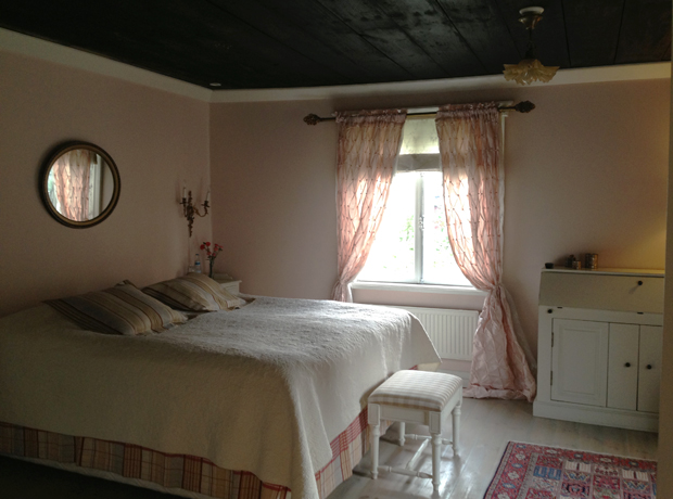 Hotel Onni The bedroom was spacious, feminine and airy. Wooden floors and ceiling set against delicate hues of pink and cream.