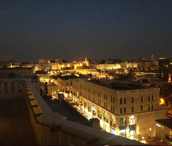 Get cocktails on the hotel rooftop for the perfect sunset and view of Jerusalem at night