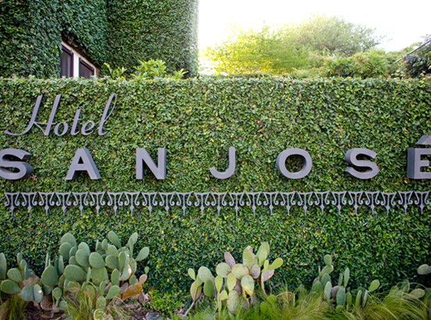 Hotel San Jose Alice in Wonderland hedges surround the hotel. 