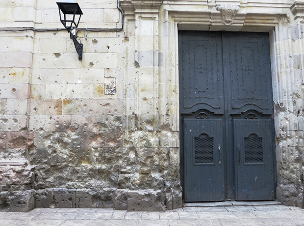 Hotel Neri Plaza Sant Felip with bullet holes in the wall, which were sustained during the Spanish Civil War. 