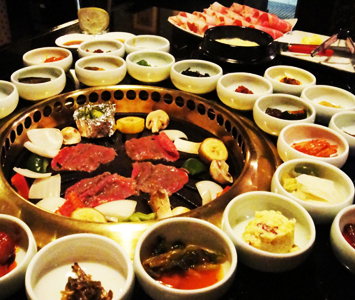 fresh meats are cooked on your table at this authentic restaurant on Wilshire. Take a piece of grilled meat, a healthy dollop of banchan and top with steamed rice.