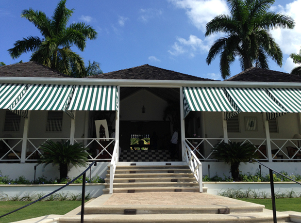 Round Hill The open-air lobby at Round Hill with its iconic black and white checkerboard tiles and green striped awnings. This is where Kingsley, the unofficial 