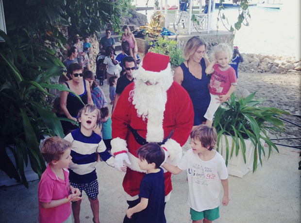 Round Hill The highlight of our trip was Santa arriving on Christmas afternoon by speedboat. That's my son Casper in the striped rash guard holding Santa's hand.