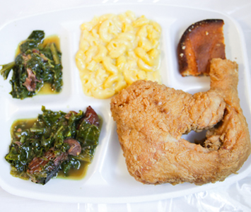 From the outside, it looks like a decrepit pastel pink shack, but this is the best home-style food in town. Delicious mac n' cheese, fried chicken and collard greens.