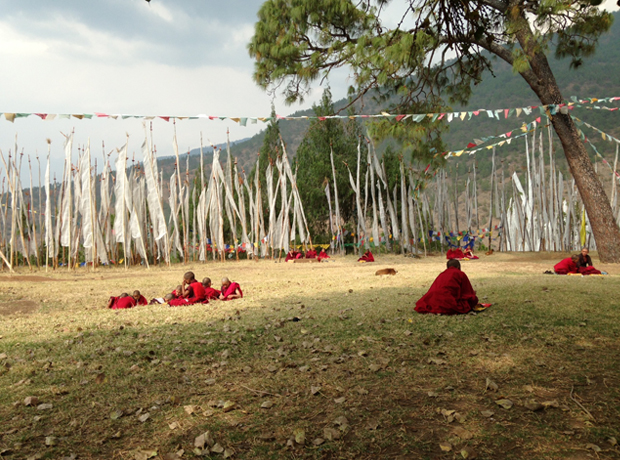 Uma Paro The most beautiful red... child monks with prayer flags at a monastery. They are sent to monasteries as young as five years old and spend their entire lifetime there.