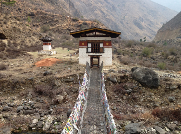 Uma Paro This bridge is made of chains and prayer flags hanging above the raging rapids. We tried to go rafting but the water levels were <br></noscript>a little low.  