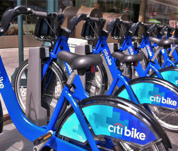 Rent a blue Citibike and ride around Central Park on a good day