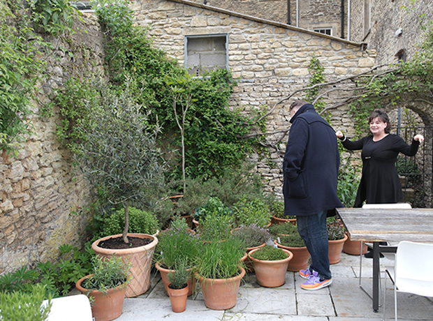 At The Chapel Catherine Butler (the owner) showing Ben the herbs on the terrace.