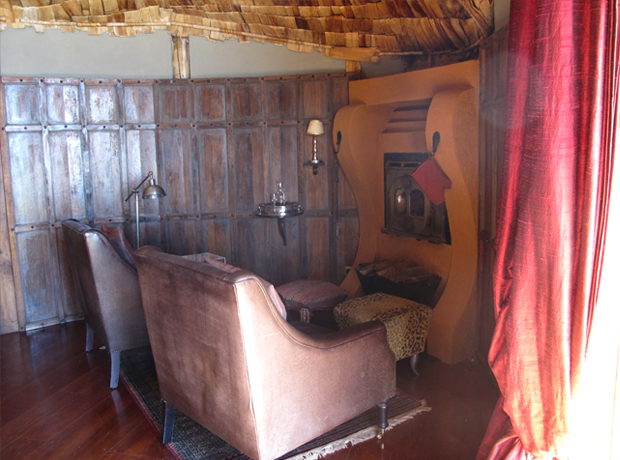 Ngorongoro Crater Lodge A cozy chill zone complete with fireplace.