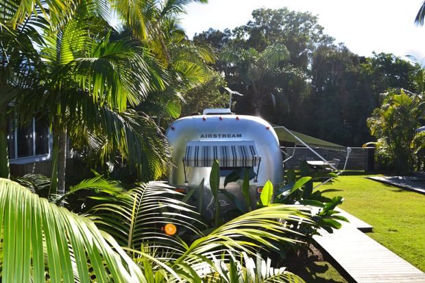 Atlantic Guesthouses A refurbished vintage airstream hides behind some palms in the outdoor garden. You can even stay in it…if you’re not too tall. 