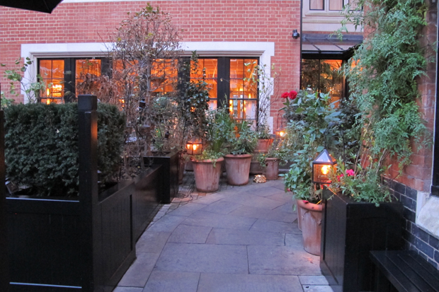 Chiltern Firehouse You enter through a gorgeous front garden/patio.