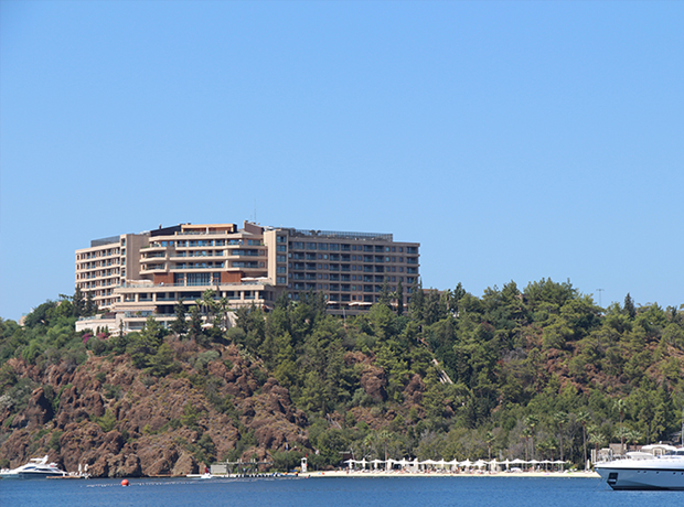 D-Hotel Maris D-Hotel Maris sits high upon a rocky hill overlooking a bay that feeds into the Agean Sea.  Perhaps you choose to arrive there in your personal yacht?