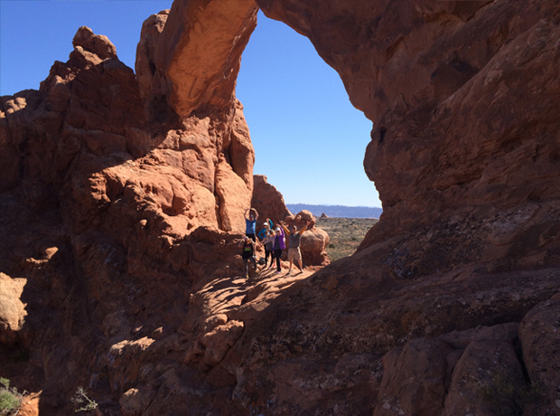 Montage Deer Valley Our encouraging guide Andy helped us traverse a steep section of rock to capture this epic photo op inside one of the arches. (Check out our interview with him in our Insider section!) 