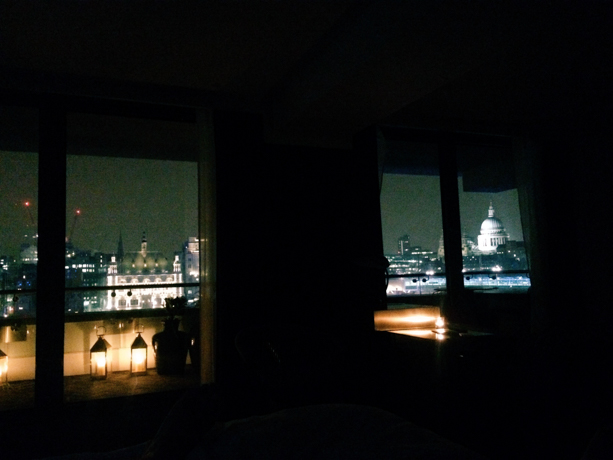 Mondrian London Lights out for bed, just lanterns and illuminated buildings of London beyond.
