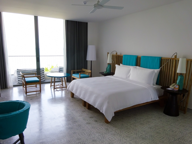 Point Yamu by COMO Teak from northern Thailand and pops of turquoise accent the Verandah Suite’s white-on-white spacious master bedroom. 