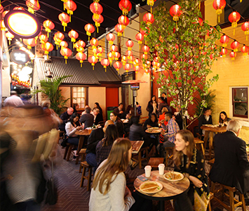 A group of four Asian street food eateries behind Glinder Coffee. Eat in the laneway on the outdoor tables.