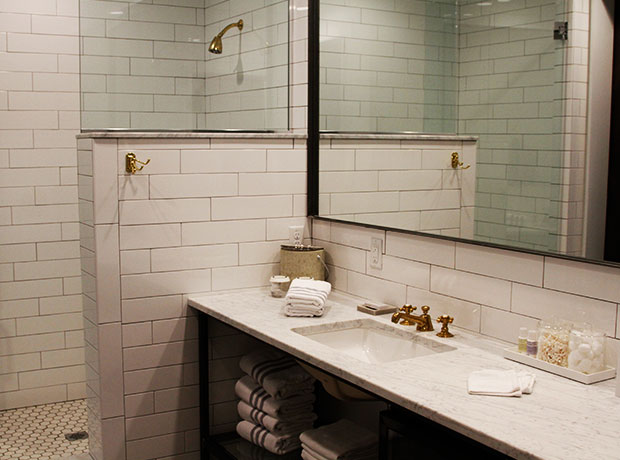 Hotel 404 The luxe, spacious bathroom with Malin + Goetz toiletries.
