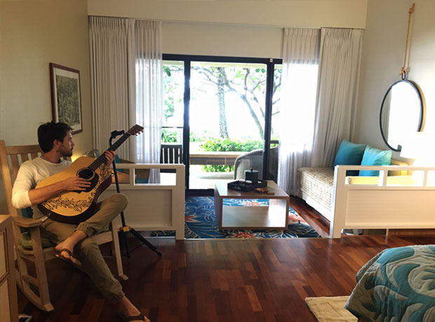 Turtle Bay Resort Hubby attempting to strum up some Don Ho on the guitar that comes with the room. 