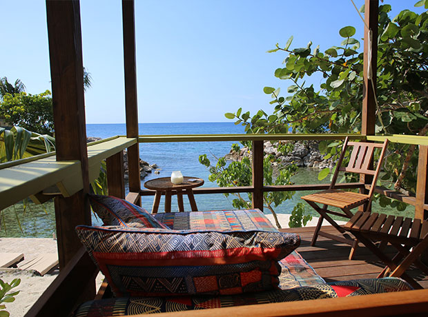 Goldeneye Beach Huts Our terrace over Snorkeler’s Cove.