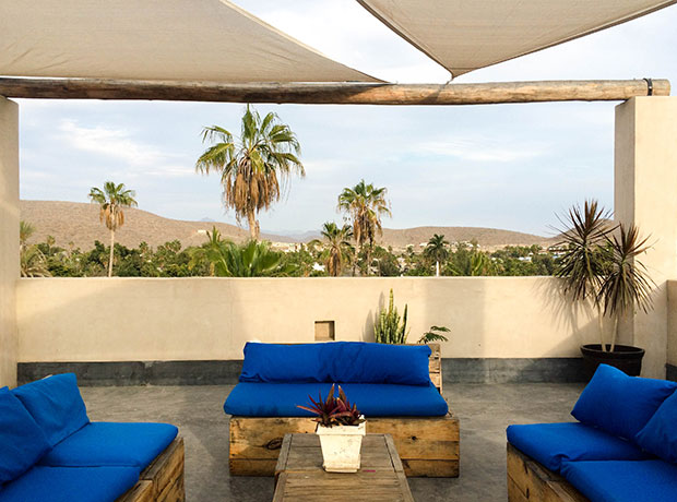 HOTEL CASA TOTA Custom-made seating makes a the rooftop a perfect spot for sunset. 