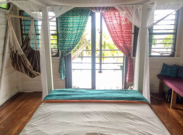 FIREFLY Bungalow in the trees complete with canopy bed and hammock chair. 
