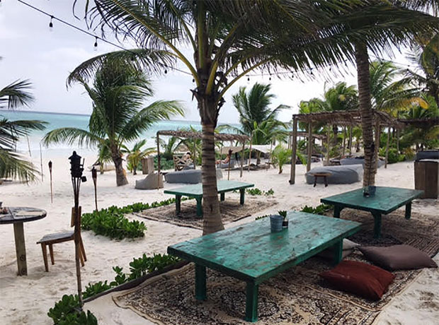 Nômade Tulum Another view of La Popular featuring beach beds in the background. If you don’t want to get up from your spot in the sun, waiters will also bring you food and drink from either of the two restaurants.