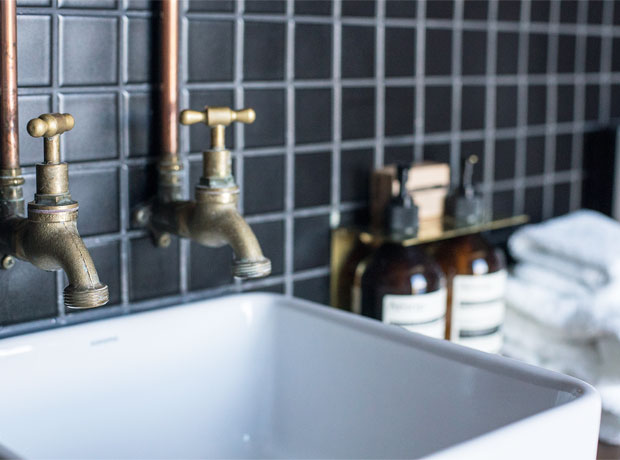 Pumphouse Point Nice bathroom details - exposed pipes and taps + Aesop soap. 