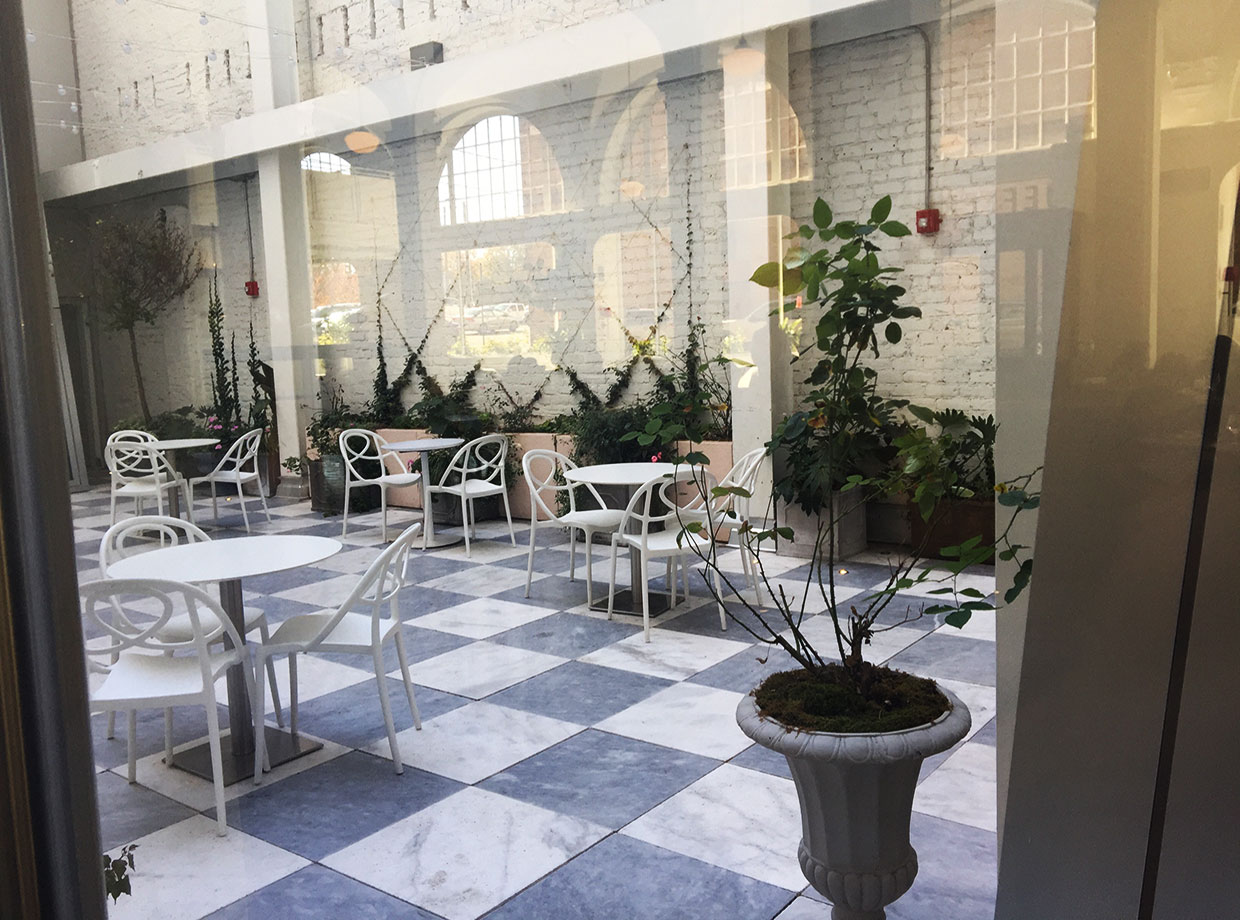 Quirk Hotel Office for the day, bright and airy courtyard.