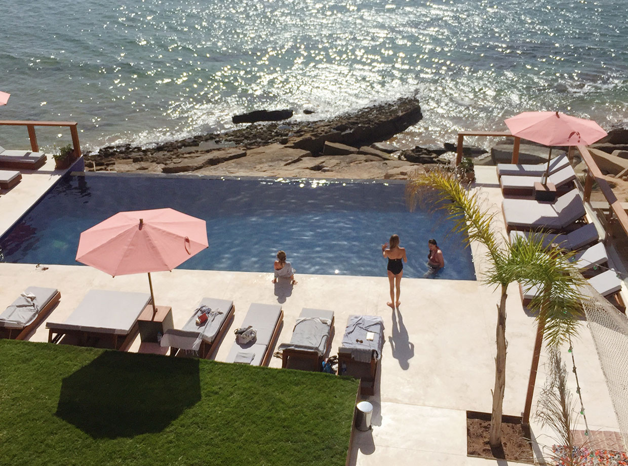 Amouage Balcony view of the garden and infinity pool.