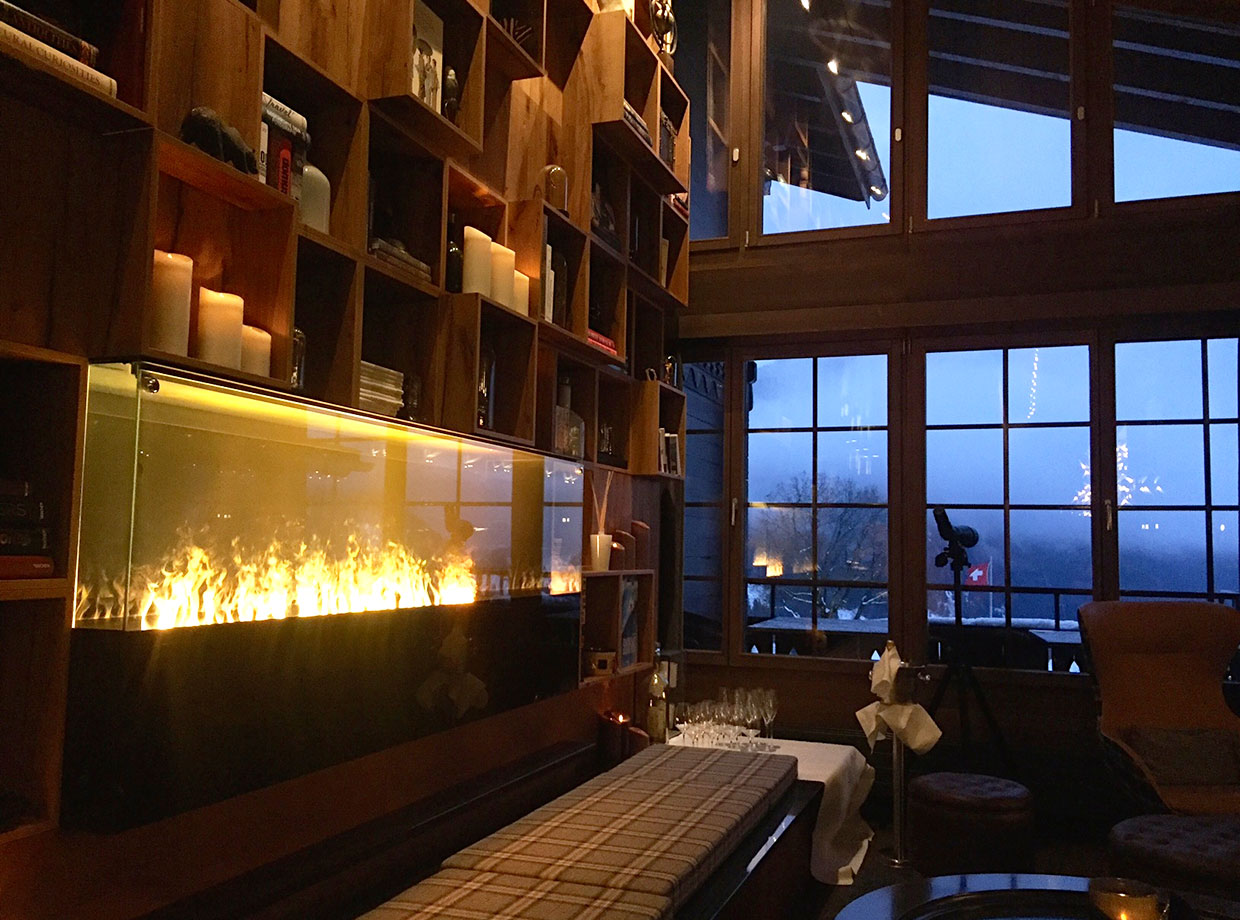 Huus Gstaad Living room lobby library.