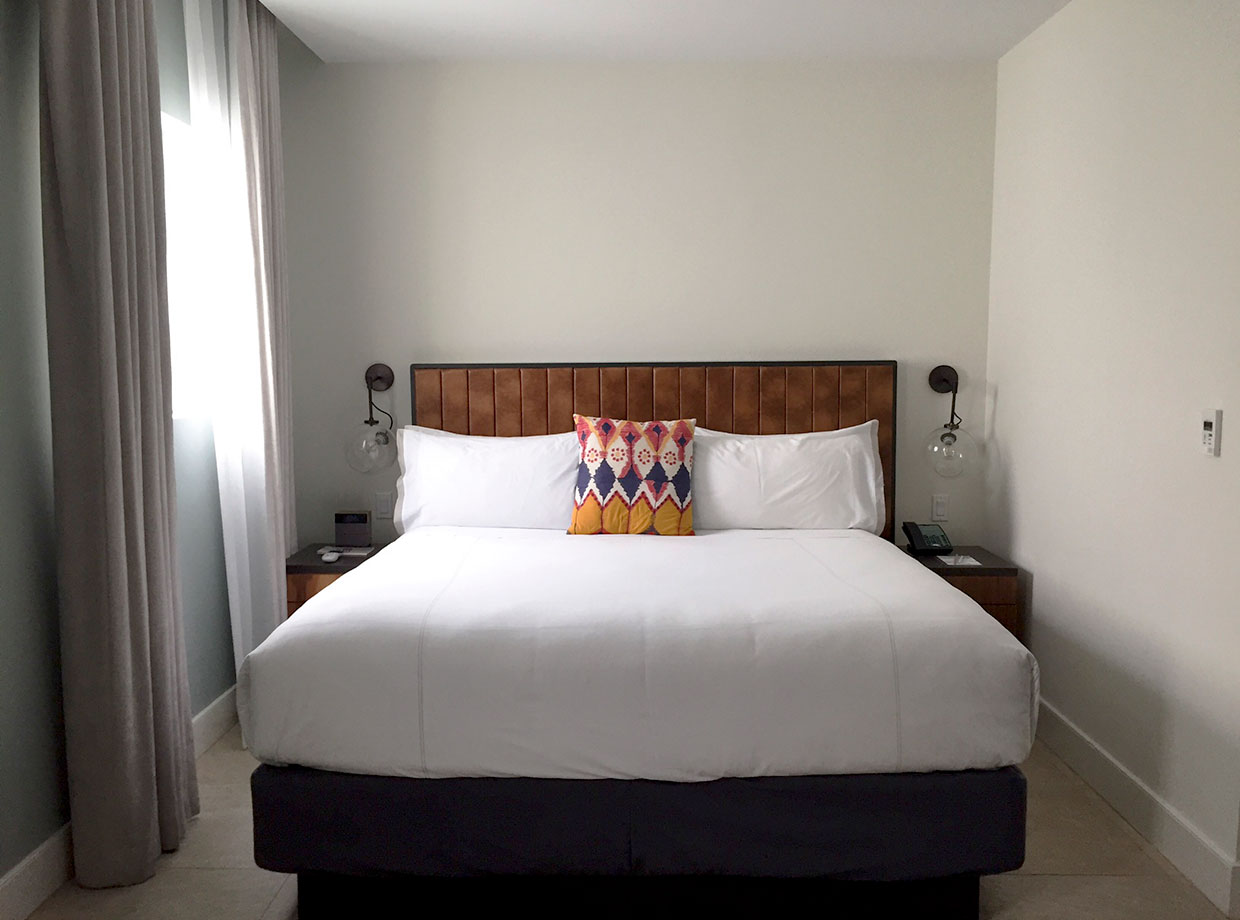 Washington Park Hotel Bedroom Suite with cozy sheets.