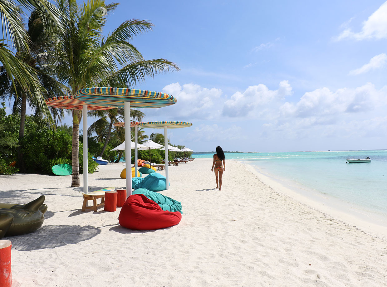 Lux* South Ari Atoll Postcard - beautiful white sand and sparkling blue waters at the lagoon.