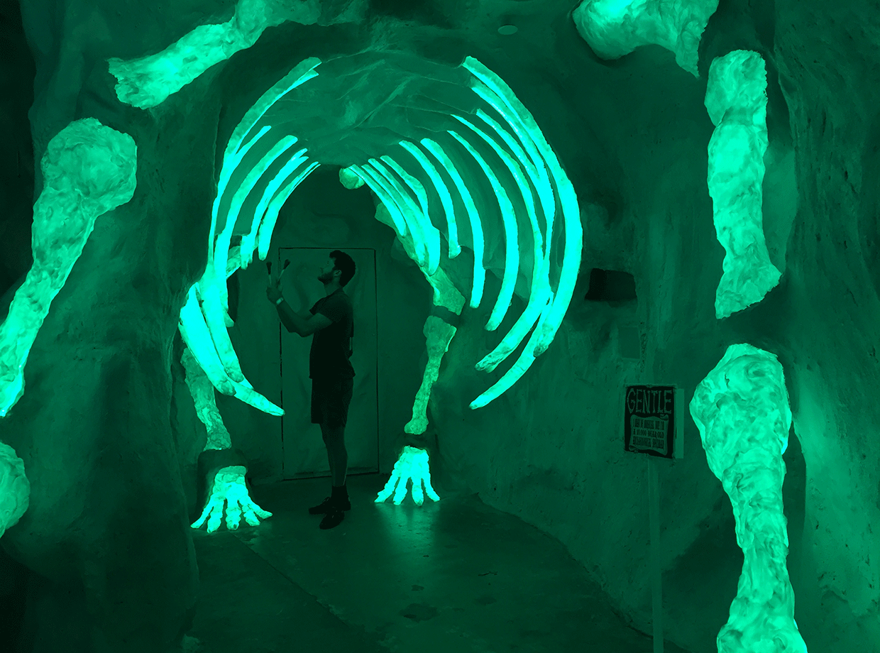 The Inn of Five Graces Playing a dinosaur’s musical rib cage at Meow Wolf’s immersive multimedia installation. 