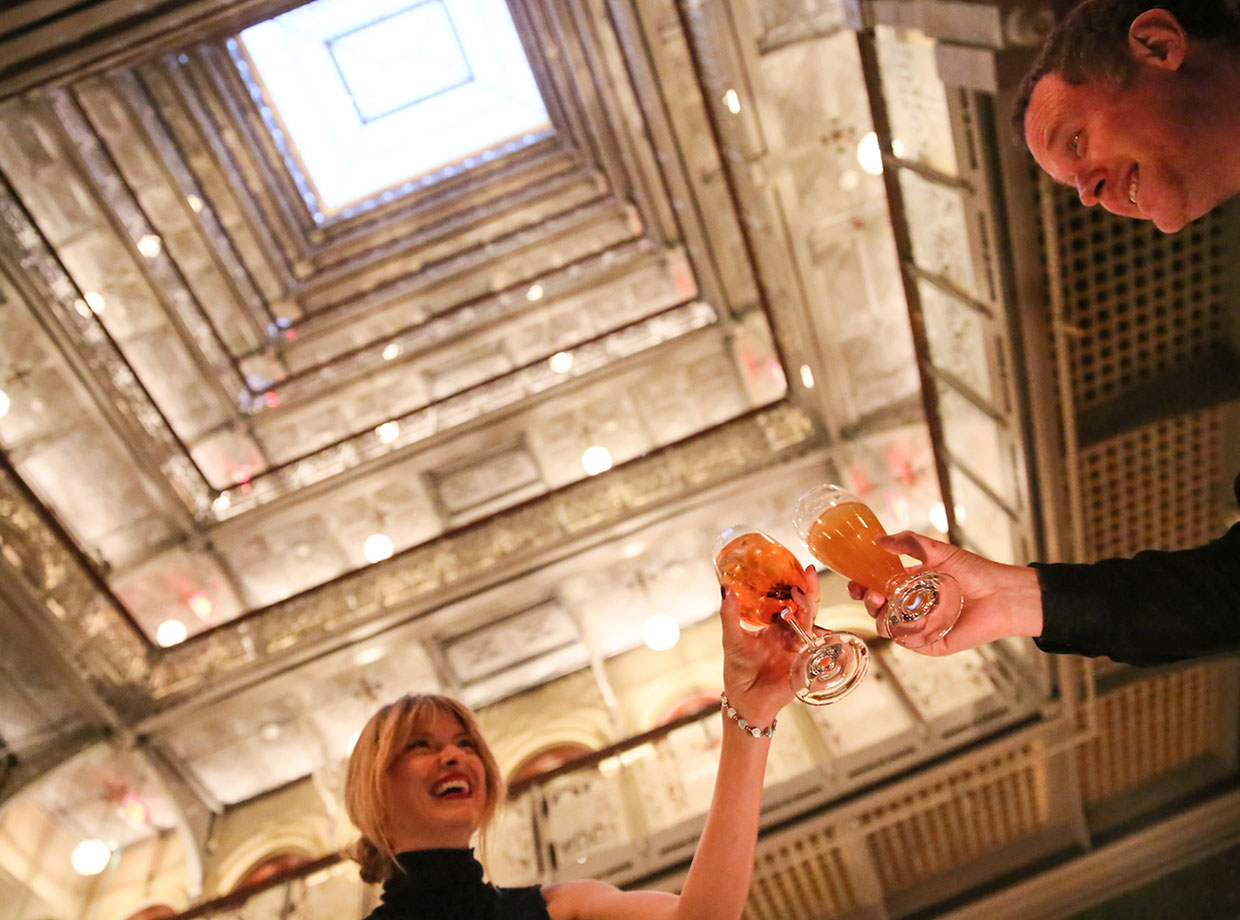 Beekman Hotel Drinks under a dramatic pyramidal skylight.