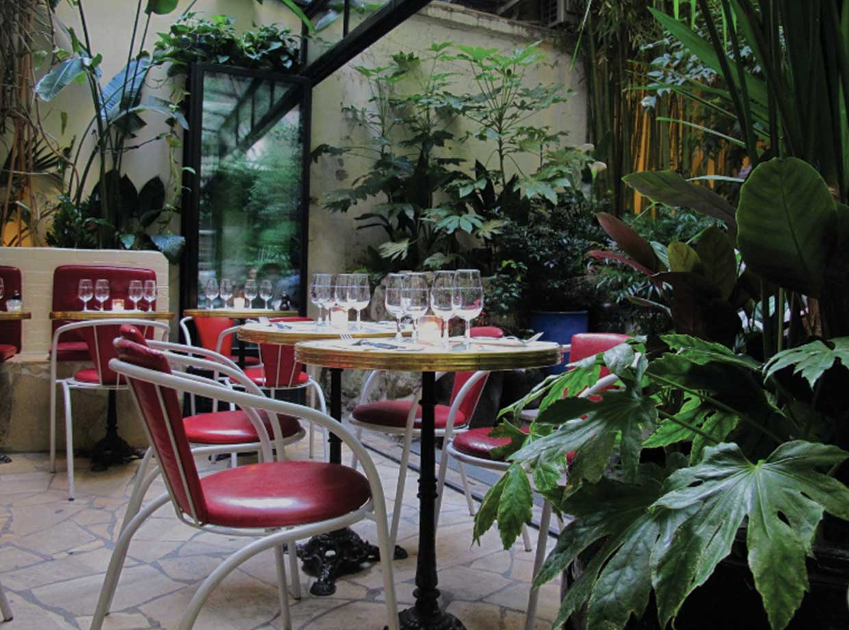 Hotel Amour ozy and classic Parisian restaurant in the courtyard is inside and outside. It opens up during the warm months and always has a fantastic atmosphere of locals and visitors alike. Intimate and closed off from the world with tons of plants. Parisian jungle anyone? 
