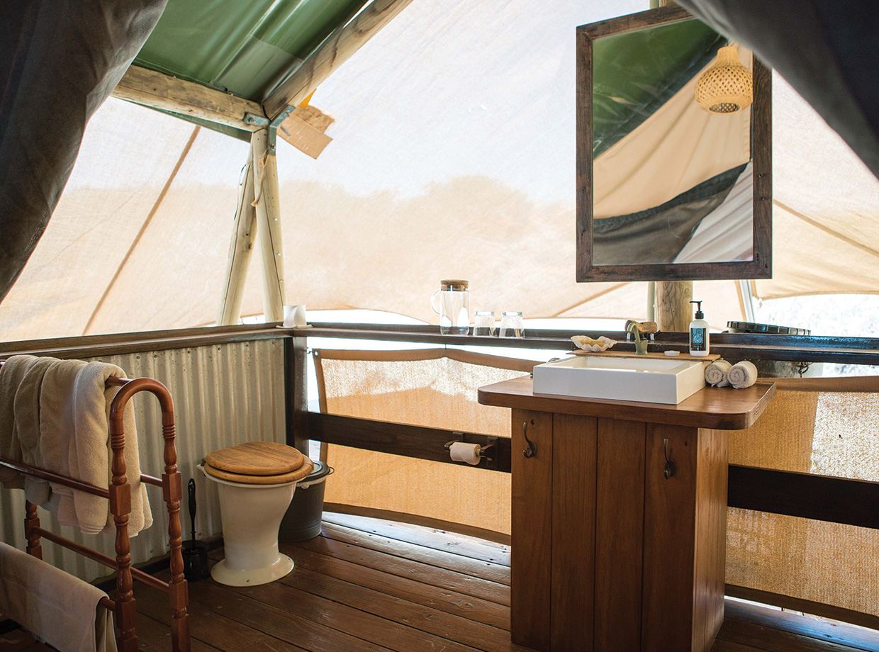 Sal Salis The bathroom at the back of the tent with waterless composting toilet and solar heated water for the shower. The most speccy tent you’ll ever sleep in – real indoor/outdoor vibes. 