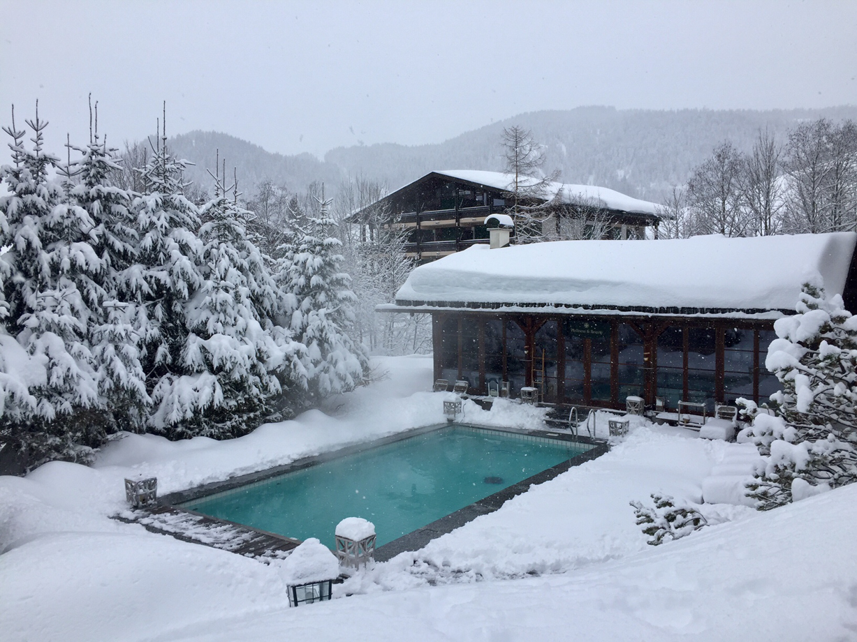 Jagdgut Wachtelhof Views from the spa over the outdoor pool and mountains.