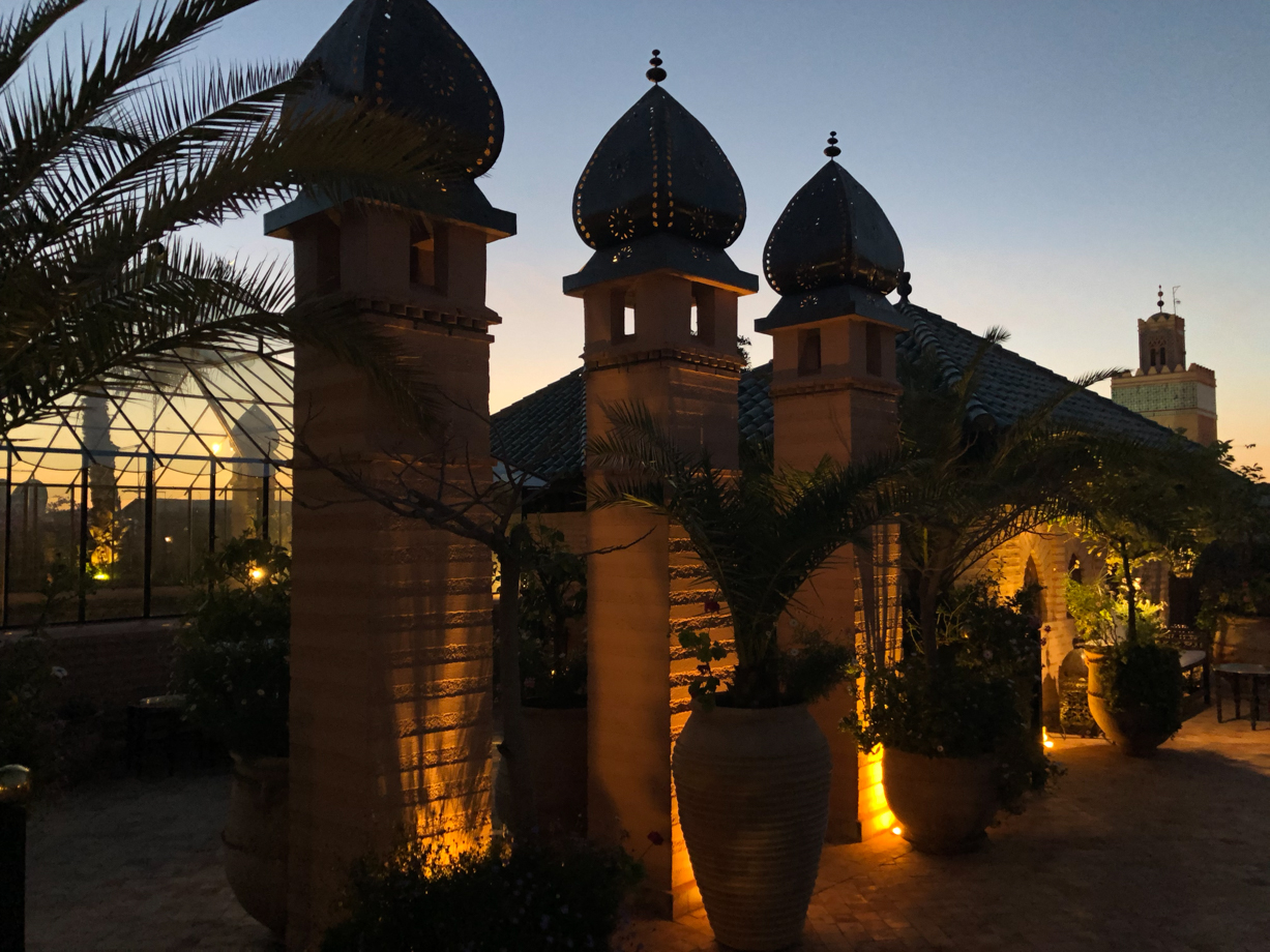 La Sultana Marrakech The rooftop at dusk with a view on the Mosque of the Kasbah next door.