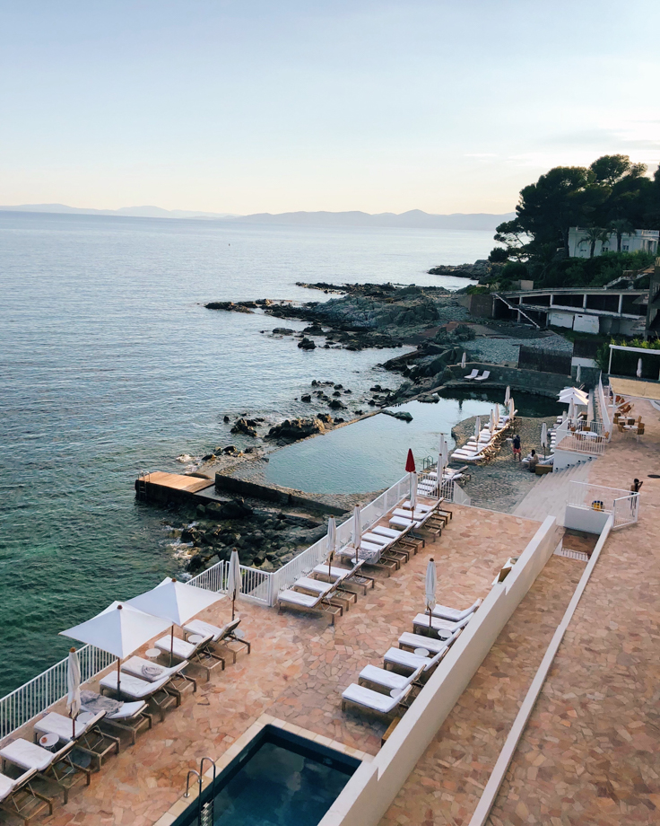 Les Roches Rouges Step through the breezy reception area, and you’re met with jaw-dropping Mediterranean views that also overlook the hotel’s gorgeous rock pool. 