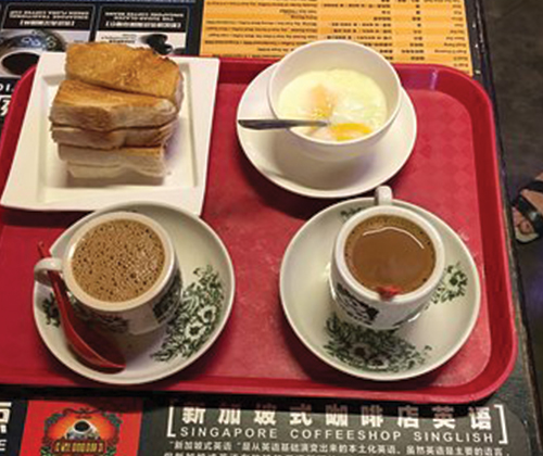 It has a helpful chart on 16 different styles of Singaporean of coffee. My order? Kopi (short black with condensed milk) and a bean bun to dip.