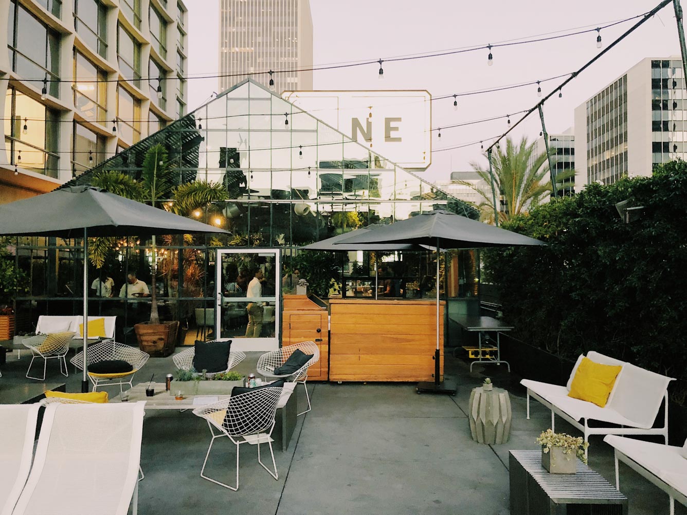 The LINE LA Taking in the greenhouse vibes and delicious eats at Openaire on the rooftop terrace.
