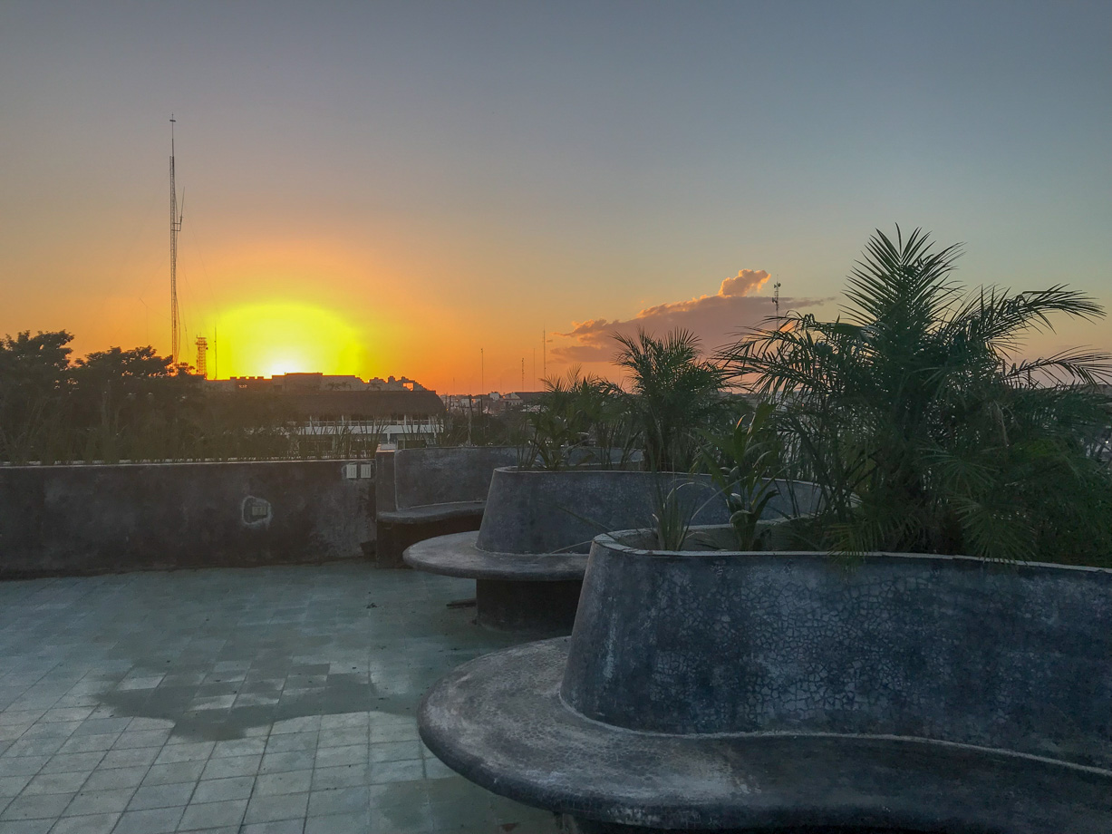 Casa Pueblo Tulum Sunset meditation on an empty rooftop.
