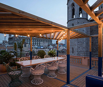 Go upstairs to the rooftop for the most incredible sunset views of Santa Maria del Mar.