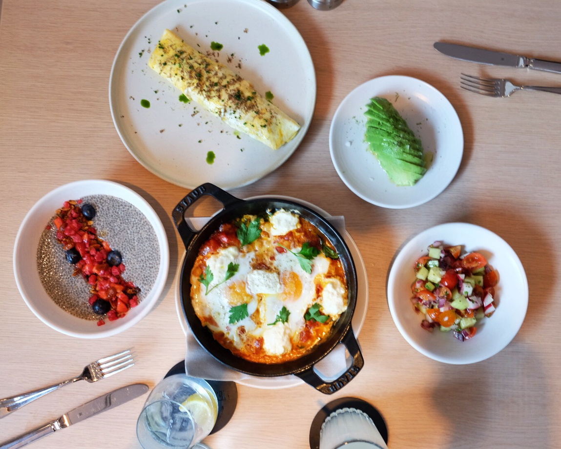 The Barcelona EDITION Breakfast spread at Bar Veraz by chef Sebastian Mazzola, featuring the signature Edition Shaksuka eggs (baked eggs with kale and feta cheese), creamy wild mushroom omelette with summer truffles, Chia pudding with horchata, and avocado. Best way to energize before walking out the door into the Gothic quarter.
