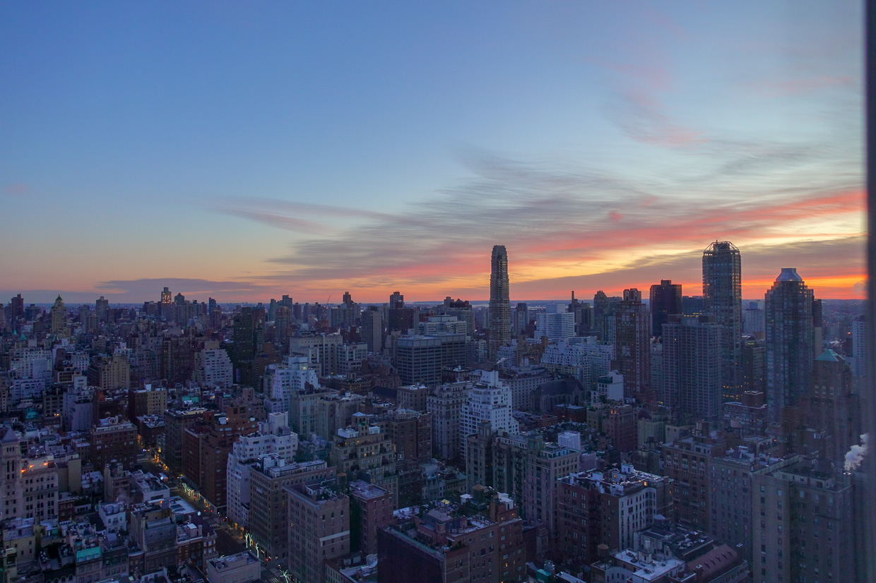 The Pierre Beautiful sunrise colors revealing the puzzled buildings.